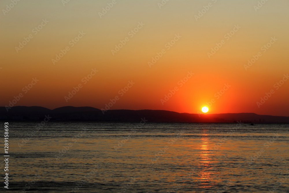 Sunset at the sea. Beautiful landscape with sun reflection on the water. Sunset at the sea. Beautiful landscape with sun reflection on the water.