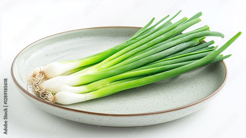 fresh green bunch of spring onion on a plate isolated on white background fresh green bunch of spring onion on a plate isolated on white background