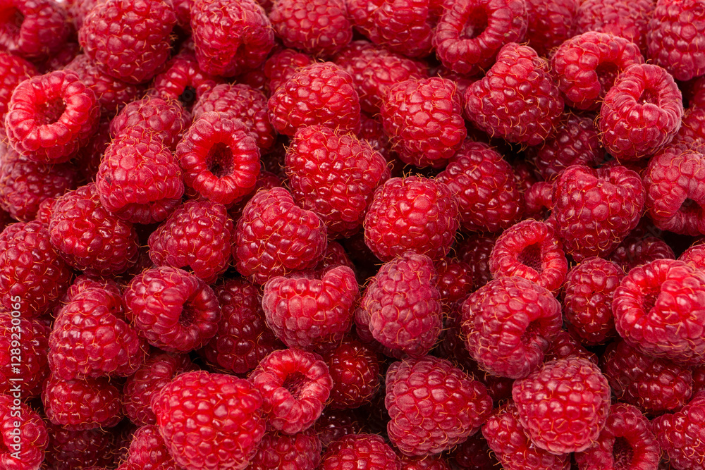 Tasty fresh raspberry as a background. Tasty fresh raspberry as a background.