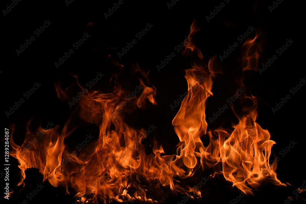 Fire blaze flames on black background. Fire burn flame isolated, abstract texture. Flaming explosion with burning effect. Fire wallpaper, abstract art pattern with copy space. Fire blaze flames on black background. Fire burn flame isolated, abstract texture. Flaming explosion with burning effect. Fire wallpaper, abstract art pattern with copy space.