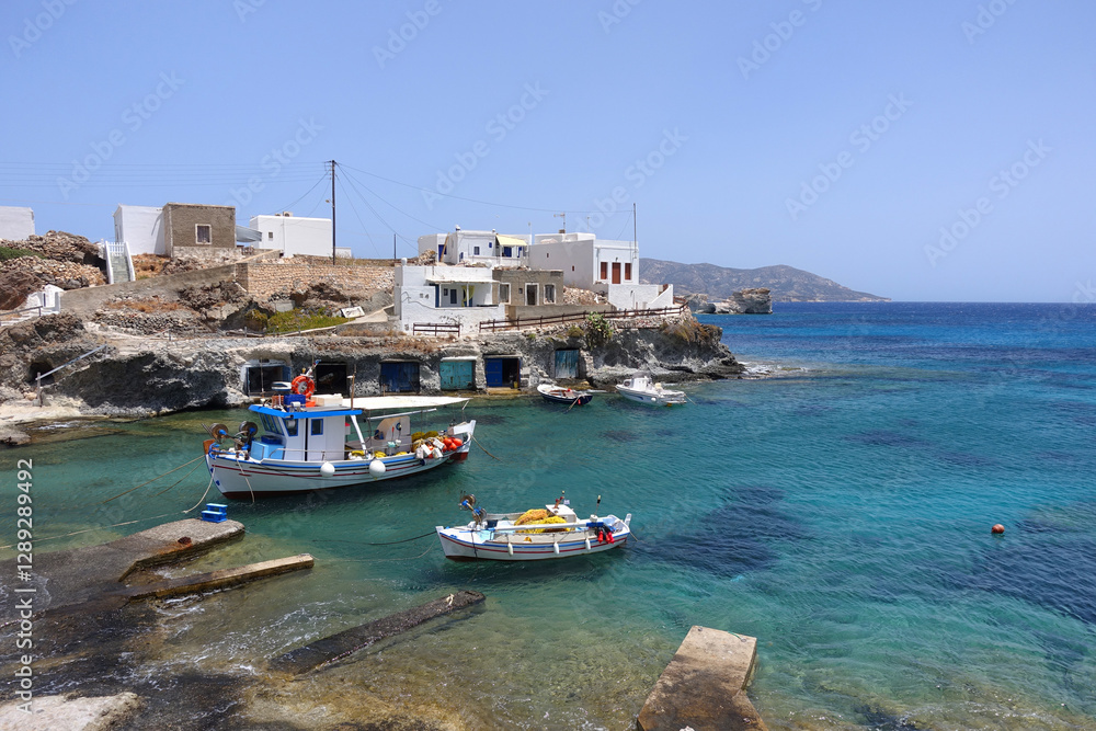 Picturesque seaside area and bay of Goupa - Karra with colourful boat houses a perfect place to swim, Kimolos island, Cyclades, Greece