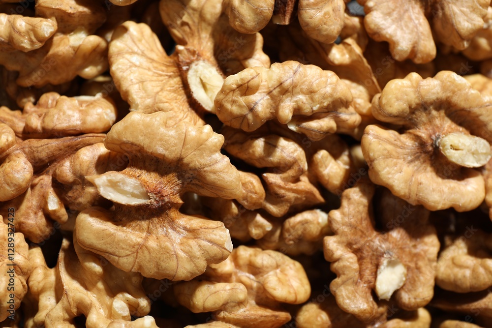 Pile of fresh ripe walnuts as background, top view Pile of fresh ripe walnuts as background, top view