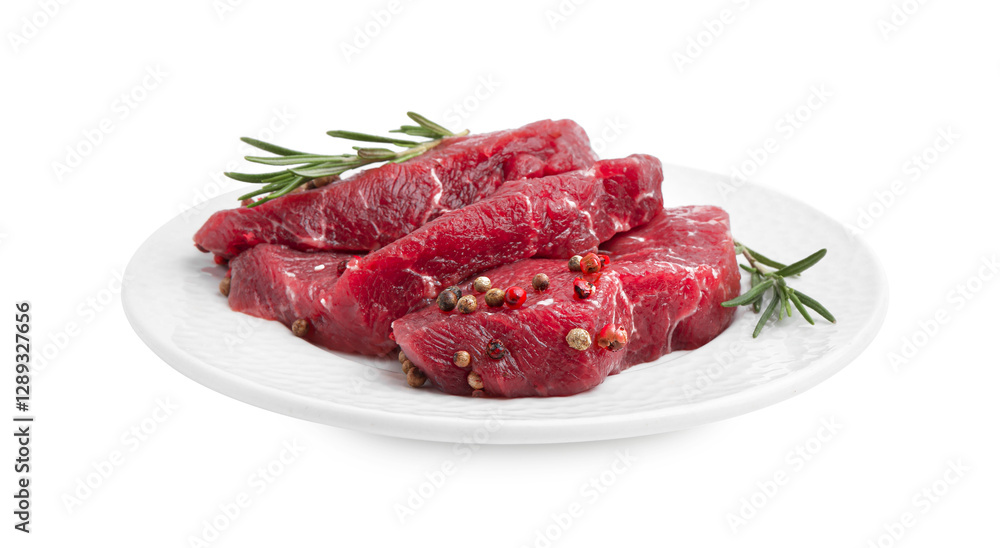 Pieces of raw beef meat and spices isolated on white Pieces of raw beef meat and spices isolated on white
