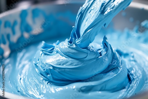 Fototapeta Naklejka Na Ścianę i Meble -  Mixing blue paint in bowl