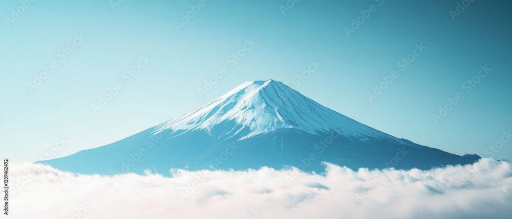 Majestic snow-capped mountain peak piercing through fluffy white clouds under a clear blue sky, exemplifying serenity and grandeur. Majestic snow-capped mountain peak piercing through fluffy white clouds under a clear blue sky, exemplifying serenity and grandeur.