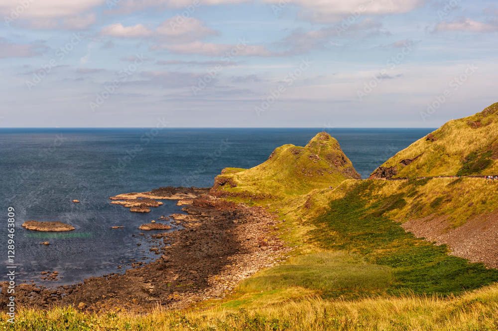 A beautiful view of the ocean with a rocky shoreline A beautiful view of the ocean with a rocky shoreline