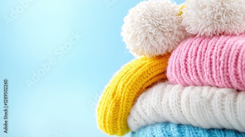 Colorful knitted hats and scarves winter stack