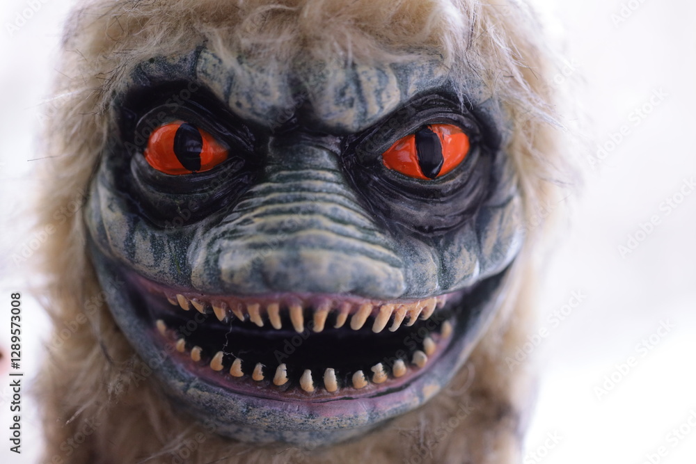 A close-up shot of a plush toy with bright red eyes. A close-up shot of a plush toy with bright red eyes.