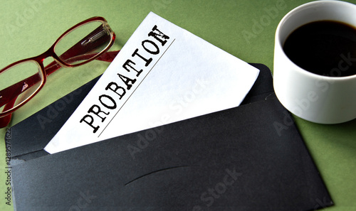 Tableau sur toile PROBATION - word on a white sheet of paper on a background of a black convers an