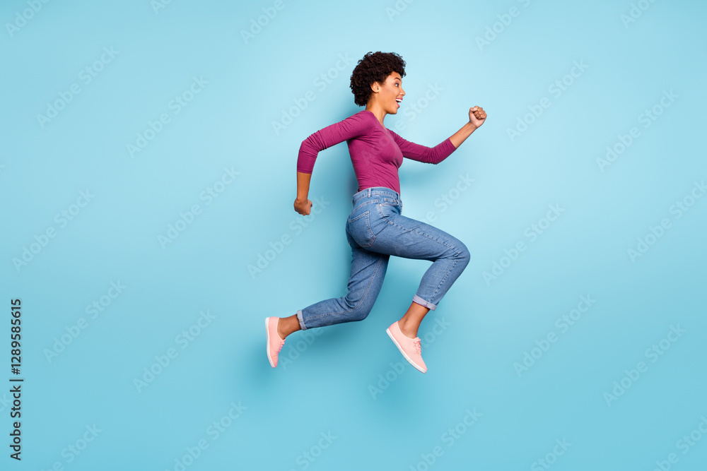 Full length body size photo of cheerful charming cute jumping fast quick woman running towards shopping mall for sales wearing jeans denim isolated over vivid color blue background Full length body size photo of cheerful charming cute jumping fast quick woman running towards shopping mall for sales wearing jeans denim isolated over vivid color blue background