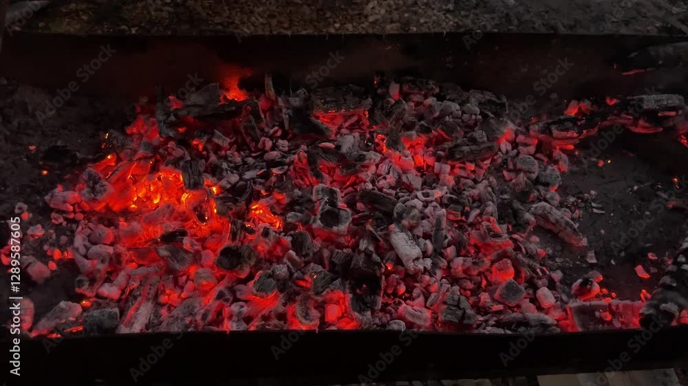 Charcoal burning in the grill brazier for cooking barbecue