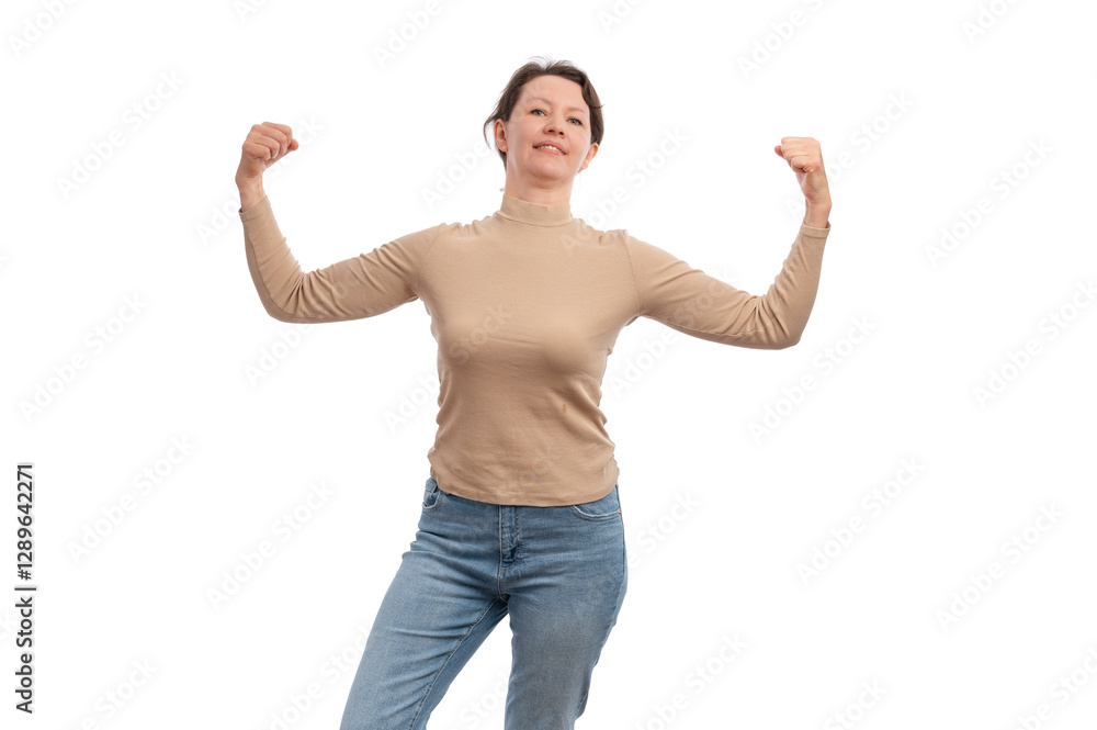 A confident woman in a beige top flexing her muscles with a smile against a white background. A confident woman in a beige top flexing her muscles with a smile against a white background.