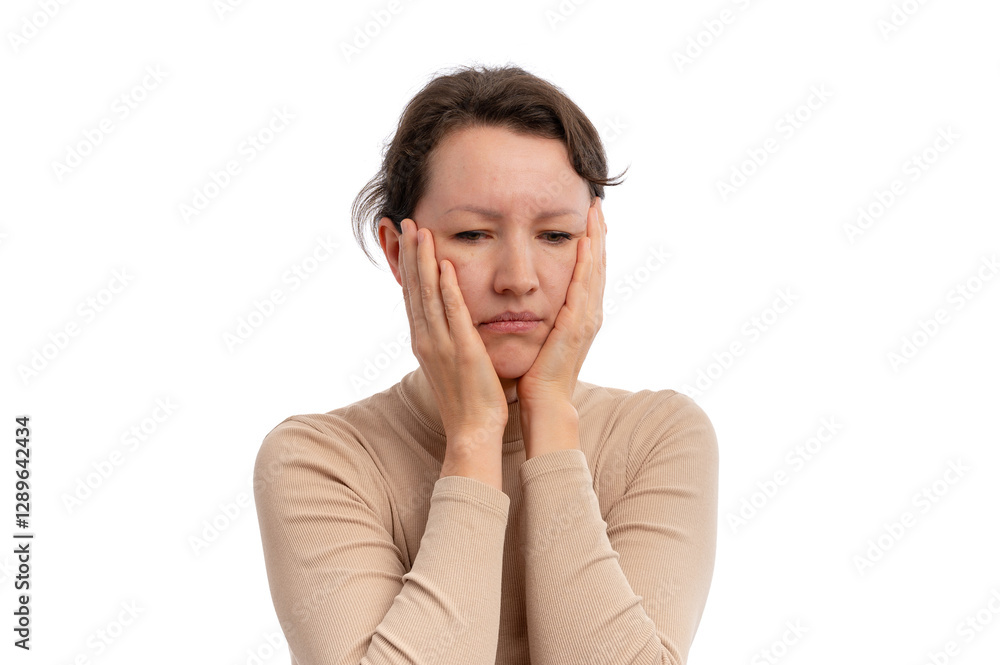 A woman with a neutral expression, holding her face in her hands against a white background. A woman with a neutral expression, holding her face in her hands against a white background.