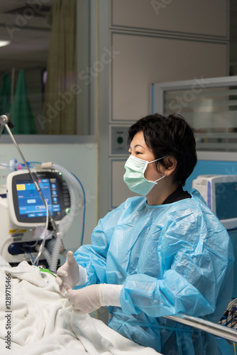 Doctor medical care patient on bed in hospital photo