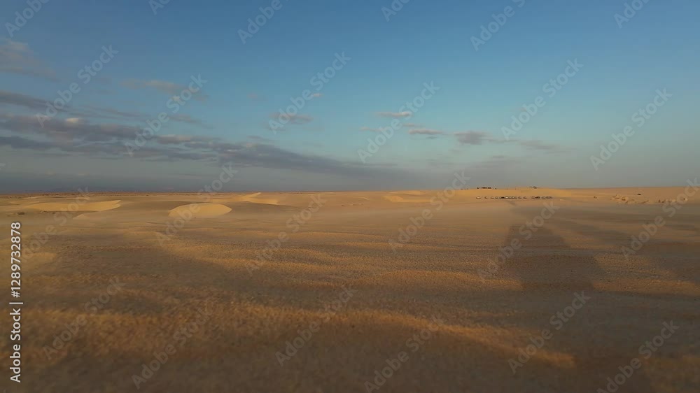 Sand blowing in the desert of Sahara Sand blowing in the desert of Sahara