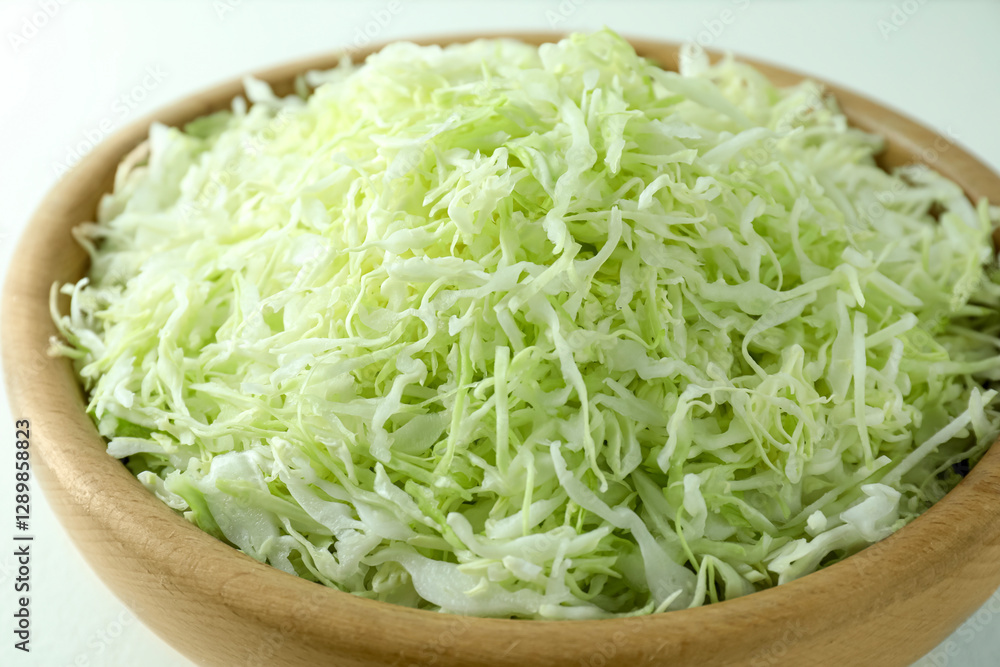 Fresh shredded cabbage on light table, closeup Fresh shredded cabbage on light table, closeup