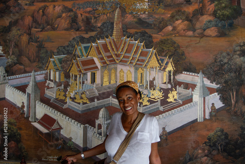 Woman in Front of Mural at Wat Po photo