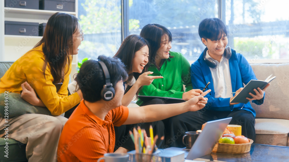 Naklejka premium Five young Asian students engage in online study on campus, collaborating on research, projects. They help each other with assignments, gaining valuable experience and preparing for future careers.