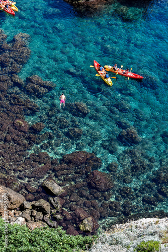 red coral reef and kayaks