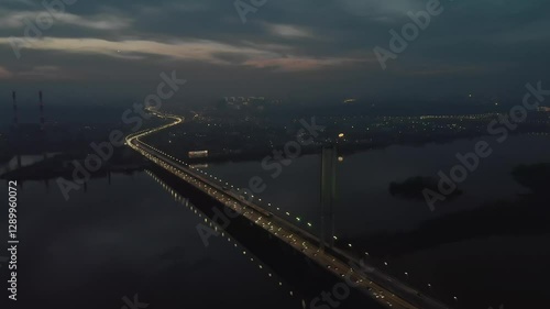 Wallpaper Mural City at Twilight with a Busy Bridge, Heavy Traffic, and a Layer of Smog and Fog. Aerial View Capturing the Urban Atmosphere, Lights, and Hazy Evening Ambience.	
 Torontodigital.ca