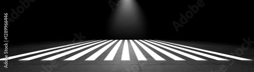 Spotlight on crosswalk; dark background; safety concept