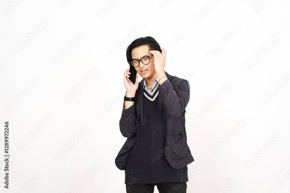 Headache while on phone Of Handsome Asian Man Isolated On White Background Headache while on phone Of Handsome Asian Man Isolated On White Background