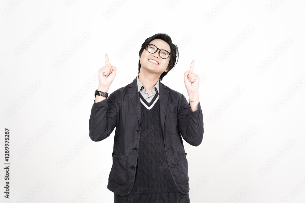 Smiling and pointing up for copy space advertising Of Handsome Asian Man Isolated On White Background Smiling and pointing up for copy space advertising Of Handsome Asian Man Isolated On White Background