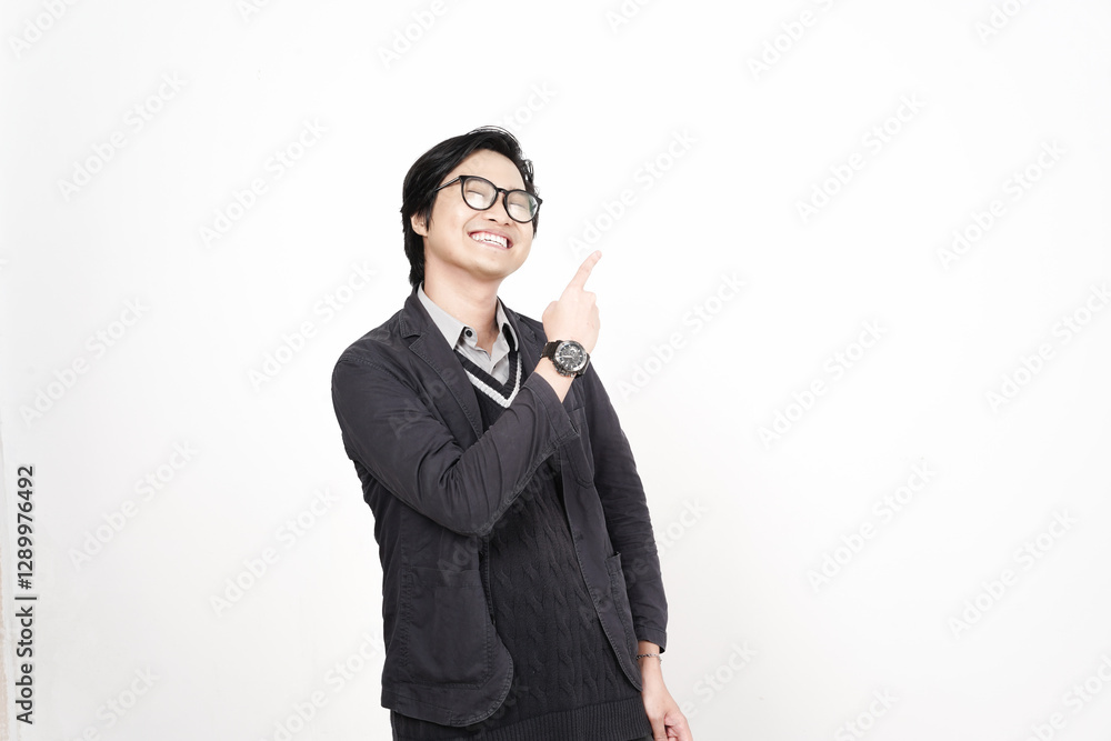 Smiling and Pointing aside for copy space advertising Of Handsome Asian Man Isolated On White Background Smiling and Pointing aside for copy space advertising Of Handsome Asian Man Isolated On White Background