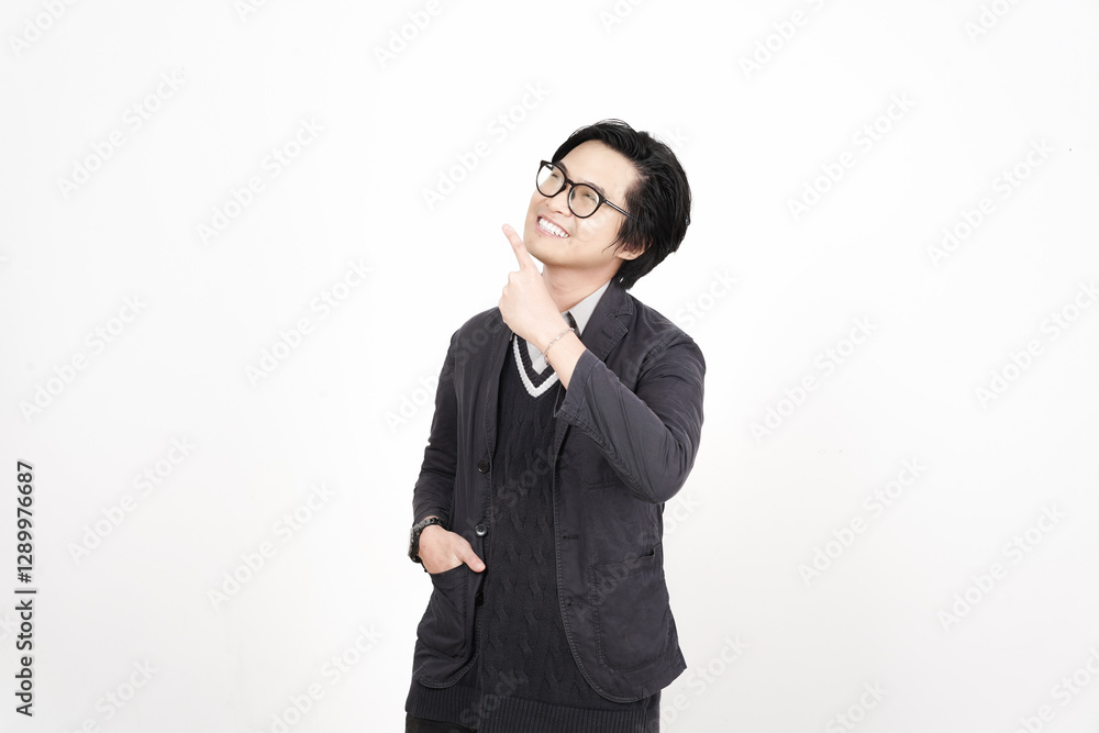 Smiling and Pointing aside for copy space advertising Of Handsome Asian Man Isolated On White Background Smiling and Pointing aside for copy space advertising Of Handsome Asian Man Isolated On White Background