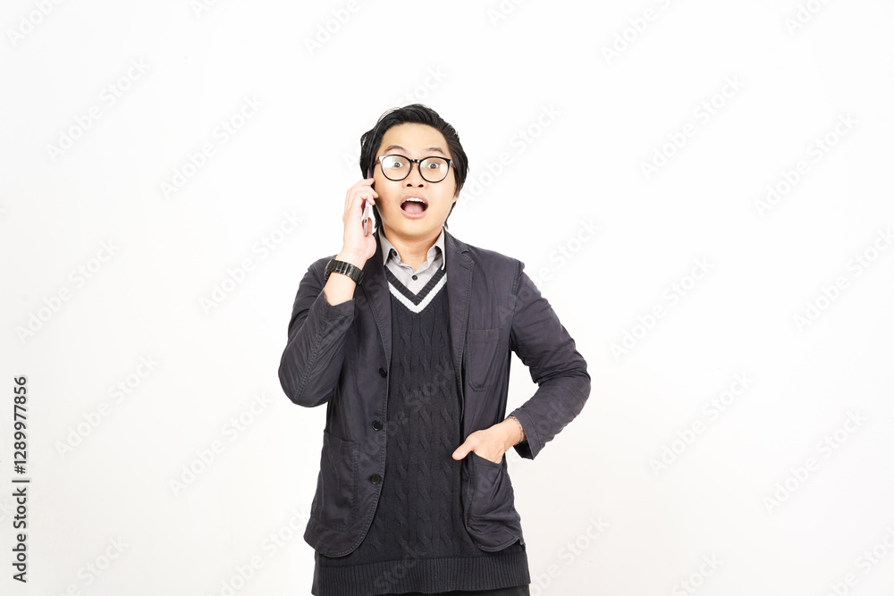 Shocked Surprised face while on phone Of Handsome Asian Man Isolated On White Background Shocked Surprised face while on phone Of Handsome Asian Man Isolated On White Background