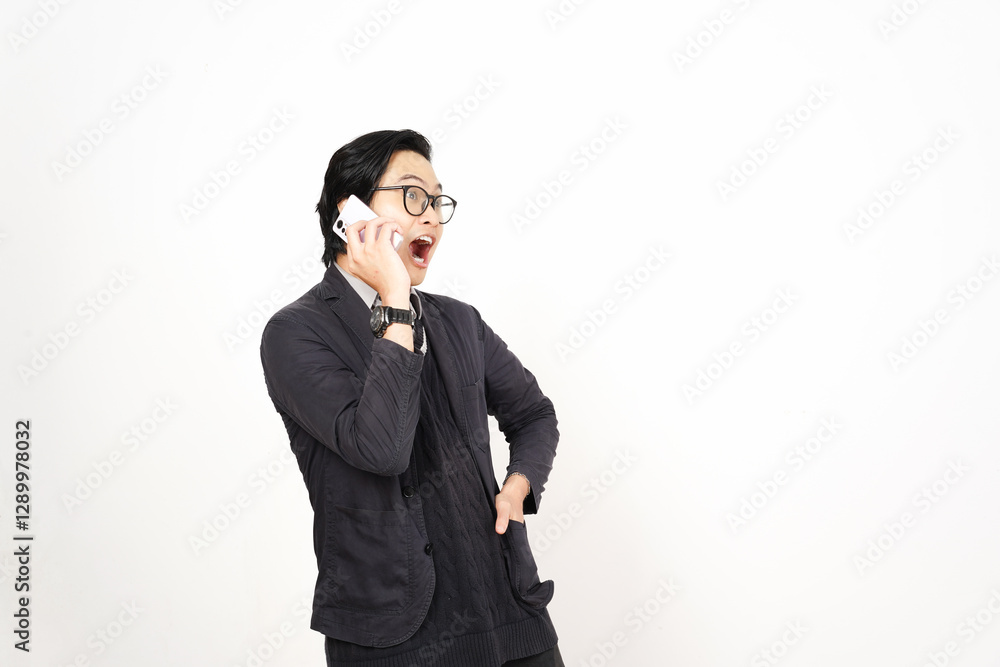 Shocked Surprised face while on phone Of Handsome Asian Man Isolated On White Background Shocked Surprised face while on phone Of Handsome Asian Man Isolated On White Background