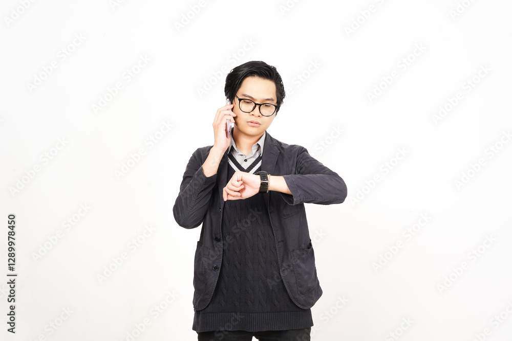 Checking Time While on Phone Of Handsome Asian Man Isolated On White Background Checking Time While on Phone Of Handsome Asian Man Isolated On White Background