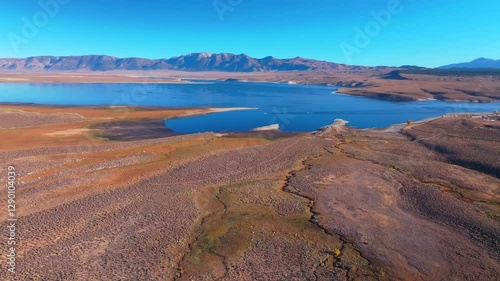 Calm Crowley Lake Stone Columns Marina boats fishing Mammoth Lakes Mountain California aerial drone October Fall autumn morning blue sky Bishop Toms Place Sierra hilltop hot springs forward motion photo