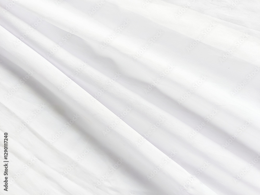 Fototapeta premium Elegant Drape: Abstract image of flowing fabric with light and shadow, creating a sense of movement and texture.