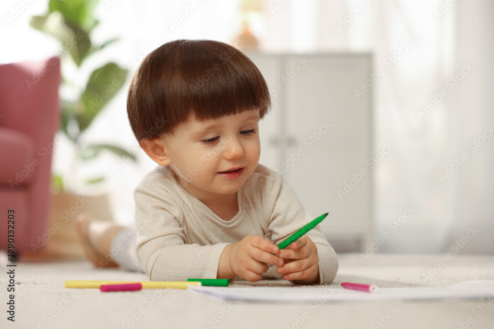 Cute little boy drawing on floor at home Cute little boy drawing on floor at home