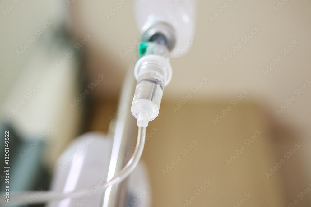 Close up medical intravenous IV drip in hospital background Close up medical intravenous IV drip in hospital background
