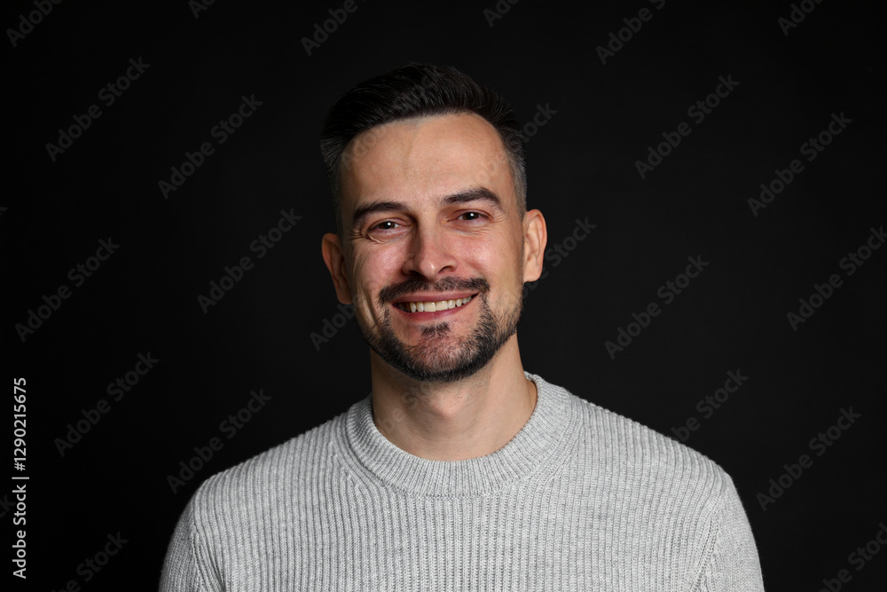 Portrait of handsome middle aged man on black background Portrait of handsome middle aged man on black background