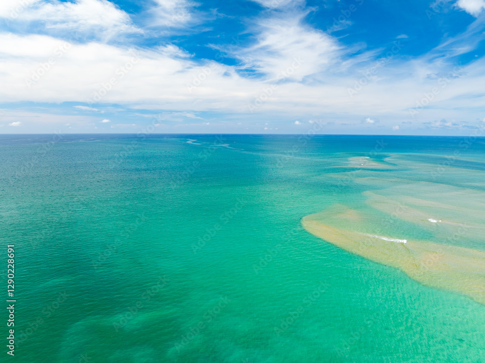 Aerial view of beautiful sea in summer season sky background,Drone view Waves water surface texture on sunny tropical ocean in Phuket island Thailand Aerial view of beautiful sea in summer season sky background,Drone view Waves water surface texture on sunny tropical ocean in Phuket island Thailand