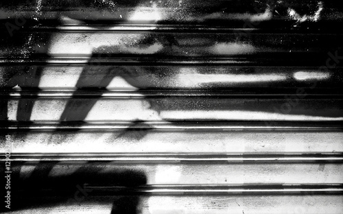 Abstract spray painting on metal door wall background. Rustic and grunge texture urban. Street and Fashion. Black and white color. Close up.