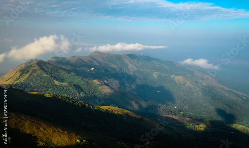 Mountain landscape with clouds as seen from Mullayanagiri Peak, Chikkamagaluru, India photo