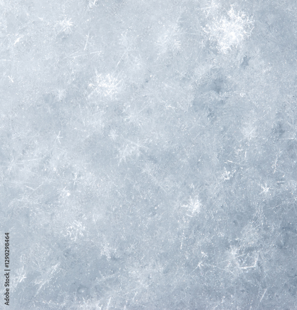 Obraz premium A snowy background with a few snowflakes scattered around