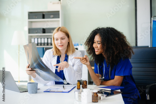 Medical, meeting and doctors with laptop for research, planning and hospital schedule management.
