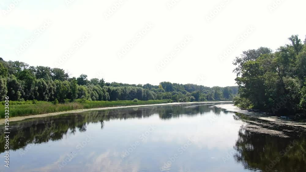 Wide open stretch along dead branch of Tisza River in Tőserdő, Hungary, low aerial flying towards bend in river. Wide open stretch along dead branch of Tisza River in Tőserdő, Hungary, low aerial flying towards bend in river.