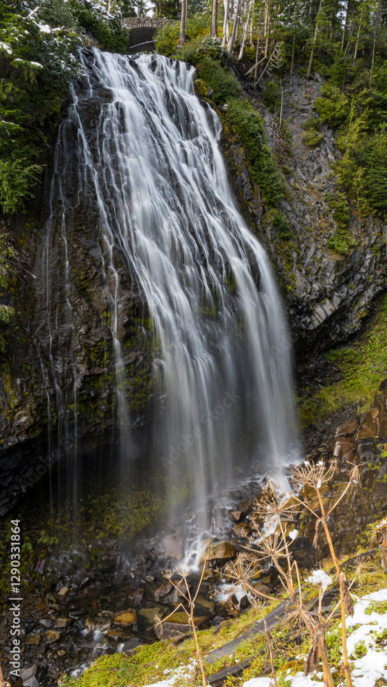 A stunning waterfall gracefully cascades over rocky cliffs, surrounded by lush greenery, capturing the dynamic beauty of nature and evoking a sense of tranquility and awe. A stunning waterfall gracefully cascades over rocky cliffs, surrounded by lush greenery, capturing the dynamic beauty of nature and evoking a sense of tranquility and awe.