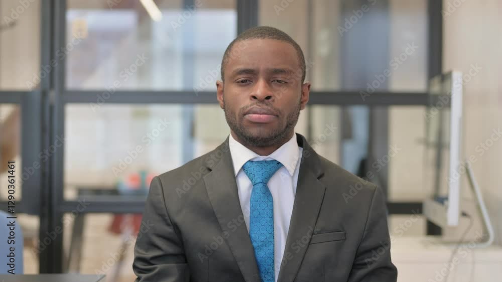 Portrait of African Businessman with Thumbs Down Portrait of African Businessman with Thumbs Down