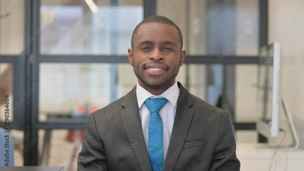 Portrait of Smiling African Businessman in Office Portrait of Smiling African Businessman in Office