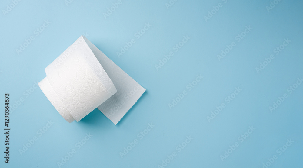 Top view of toilet paper roll on blue background Top view of toilet paper roll on blue background