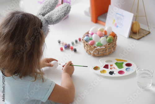 Little girl wearing bunny e...