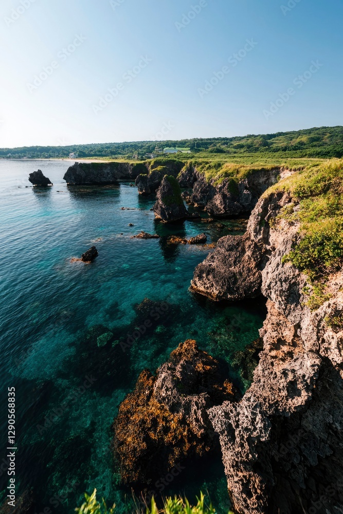 Obraz premium Rocky coast of Okinawa, Japan, with clear turquoise water ideal for travel images