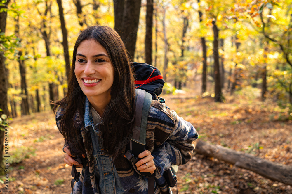 A joyful young woman with a backpack, hiking through a forest trail. The sun peeks through the leaves, highlighting her positive energy and connection with nature A joyful young woman with a backpack, hiking through a forest trail. The sun peeks through the leaves, highlighting her positive energy and connection with nature